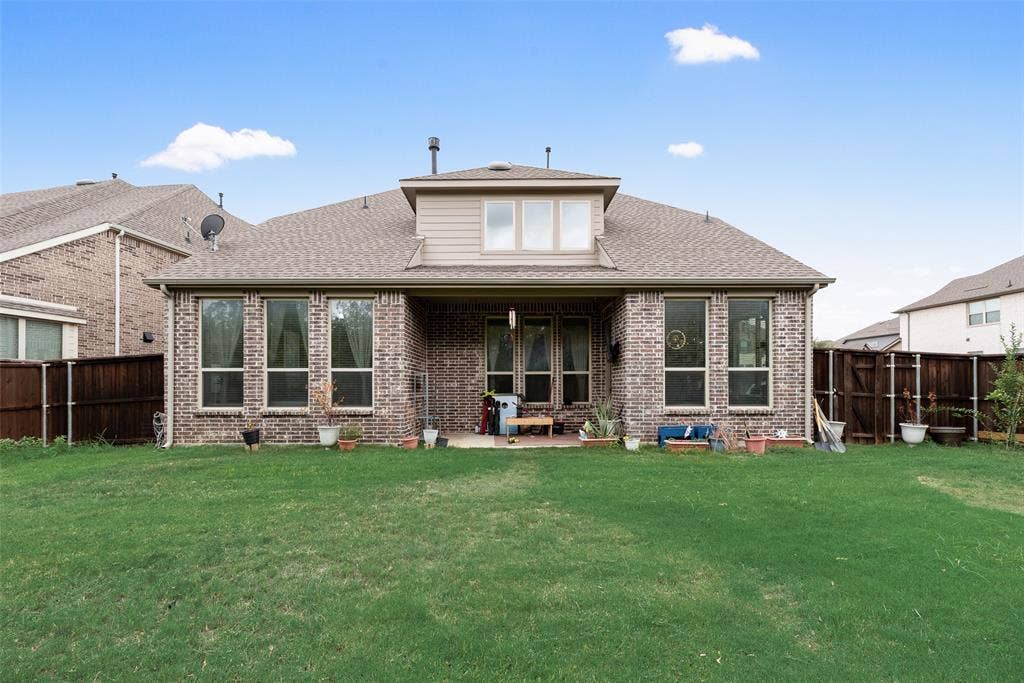 718 Waterbrook Parkway, Argyle, TX 76226 Expansive grassy yard with a full privacy fence