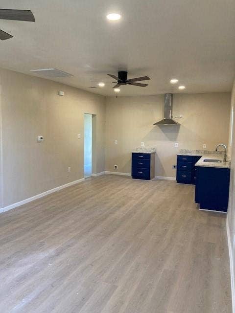608 Turner Street, Waco, TX 76704 Wood-finish flooring throughout, complemented by recessed lighting and ceiling fans