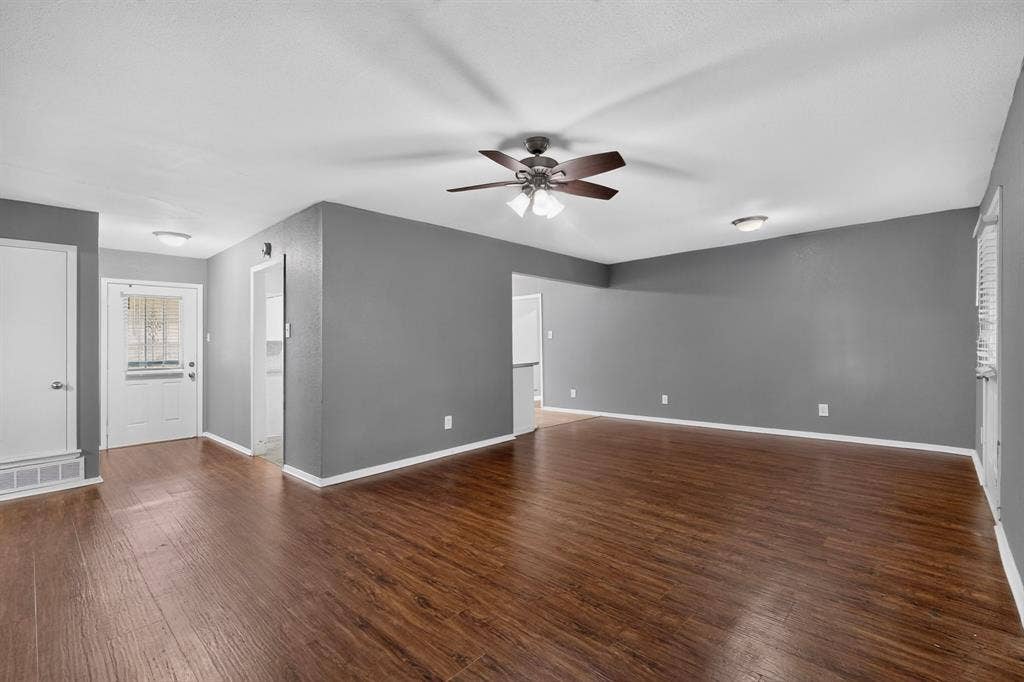 101 Spinner Circle, DeSoto, TX 75115 Wood-finish flooring throughout, ceiling fan with integrated lighting, recessed lighting, and a white paneled door with glass inserts
