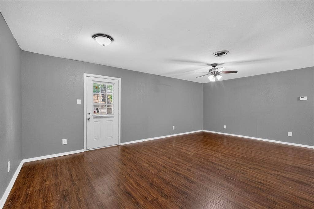 101 Spinner Circle, DeSoto, TX 75115 Wood-finish flooring, ceiling fan with light, recessed lighting, and a white paneled door with window inserts