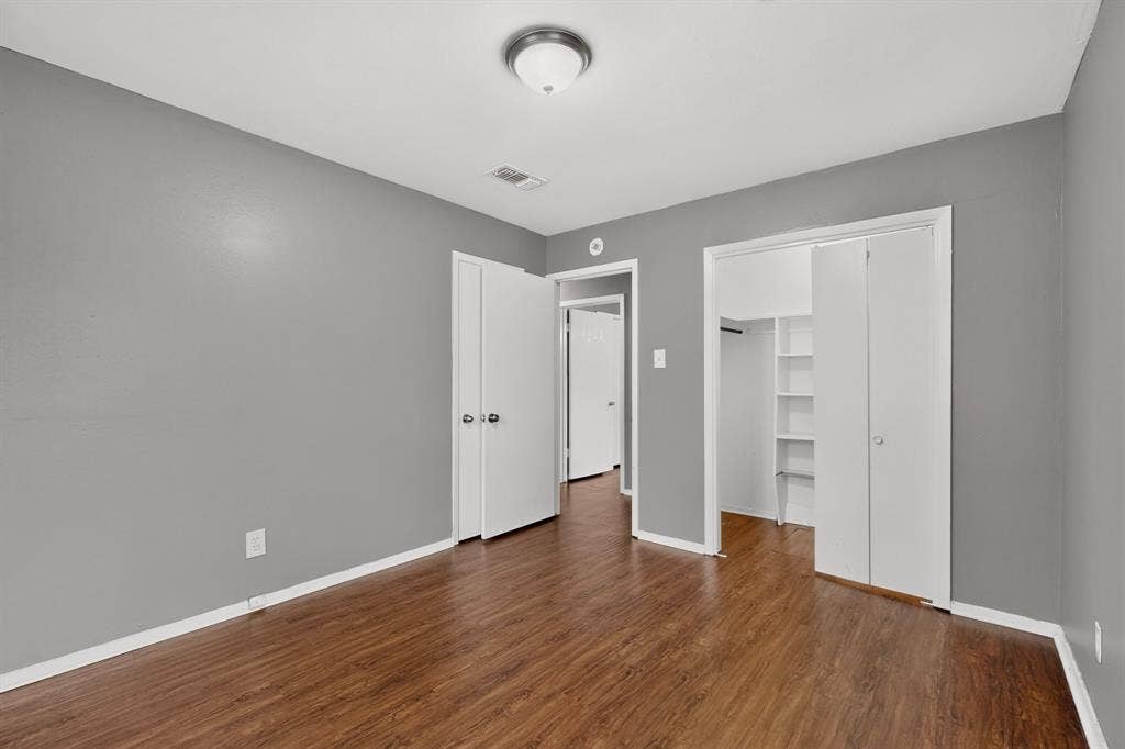 101 Spinner Circle, DeSoto, TX 75115 Wood-finish flooring, neutral gray walls, and white trim throughout
