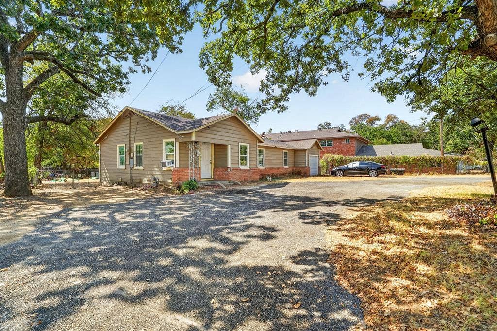 5800 Dallas Avenue, Fort Worth, TX 76112 Single-story exterior with horizontal siding and brick accents