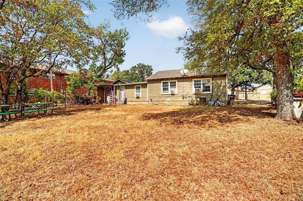 5800 Dallas Avenue, Fort Worth, TX 76112 Rear exterior with multiple windows and mature trees