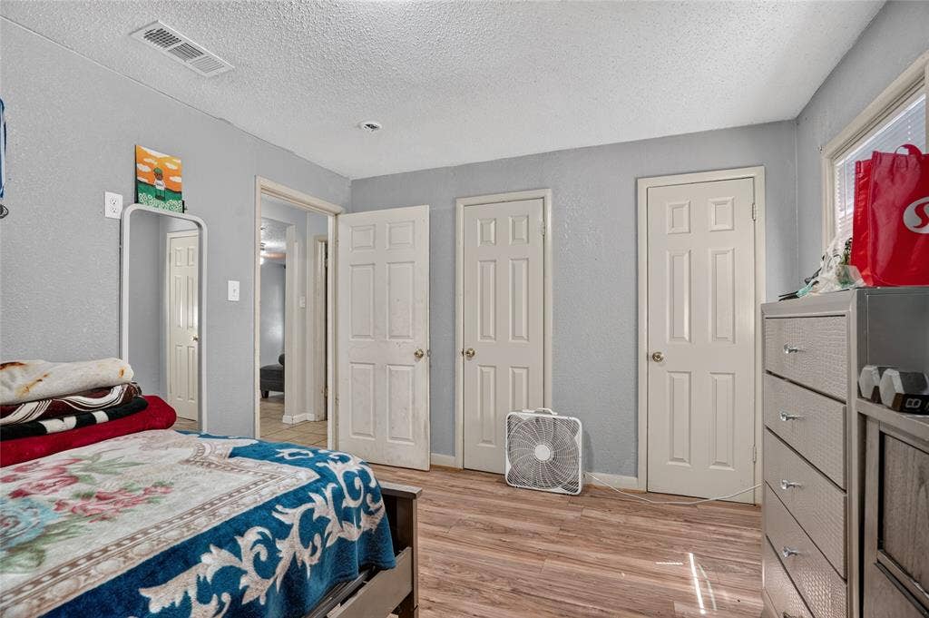 5800 Dallas Avenue, Fort Worth, TX 76112 Wood-finish flooring with light gray walls and white trim