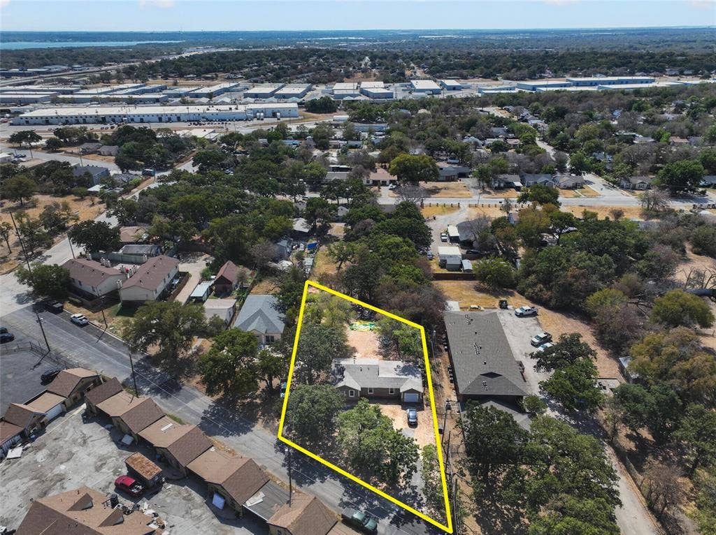 5800 Dallas Avenue, Fort Worth, TX 76112 Expansive property featuring mature trees and a residential structure
