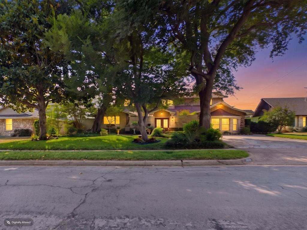 9335 Whittenburg Gate, Dallas, TX 75243 Expansive front lawn with mature trees and established landscaping