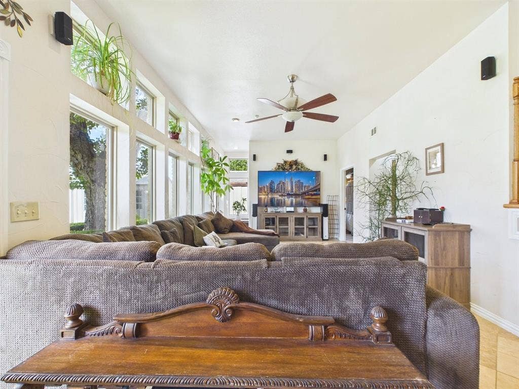 9335 Whittenburg Gate, Dallas, TX 75243 Vaulted ceiling, expansive windows, wood-finish flooring, ceiling fan with light, recessed wall niche