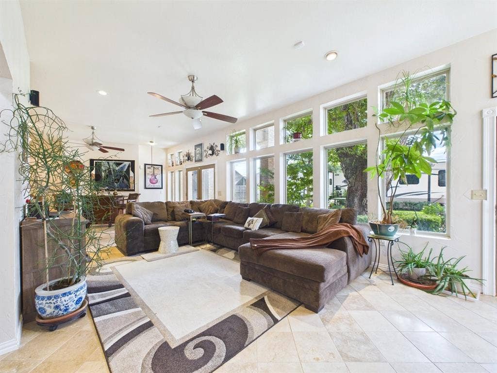 9335 Whittenburg Gate, Dallas, TX 75243 Living area with high ceilings, recessed lighting, tile flooring, and multiple large windows