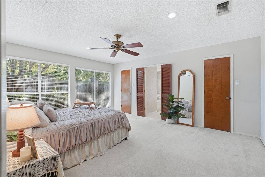 Recessed lighting, wood-finish doors, and a ceiling fan with light fixture