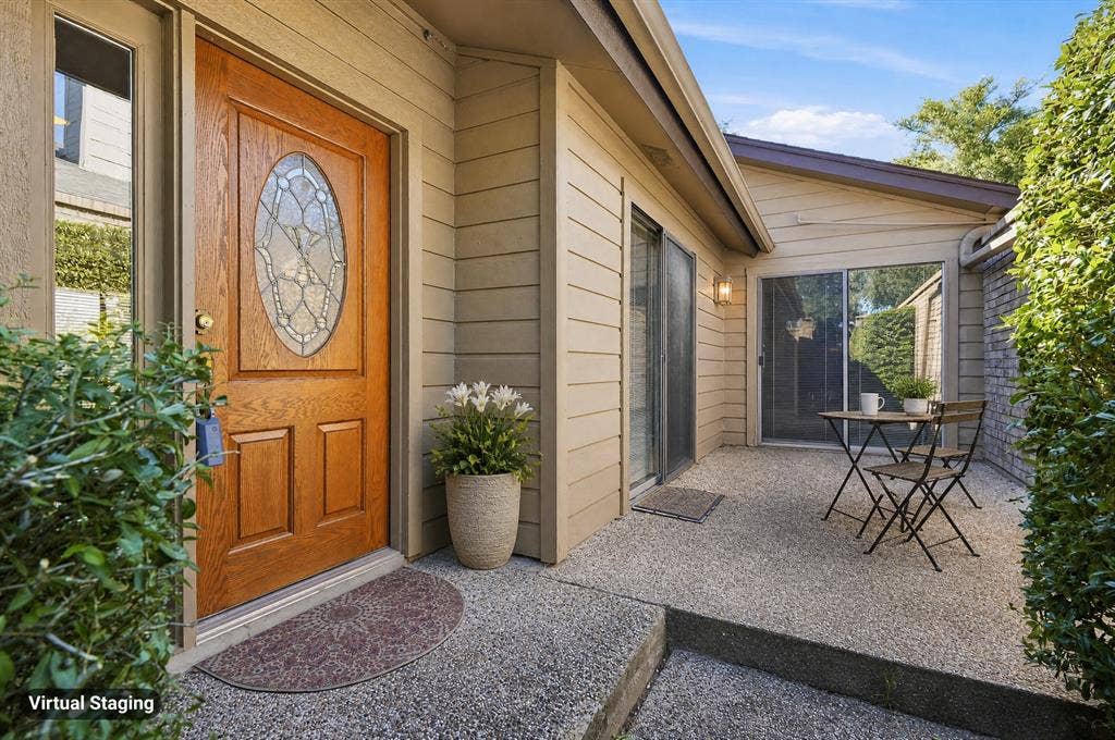Wood-paneled entry door with decorative glass insert