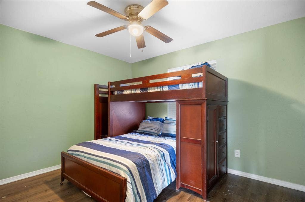 Irving, TX 75060 Wood-finish flooring with light green wall color