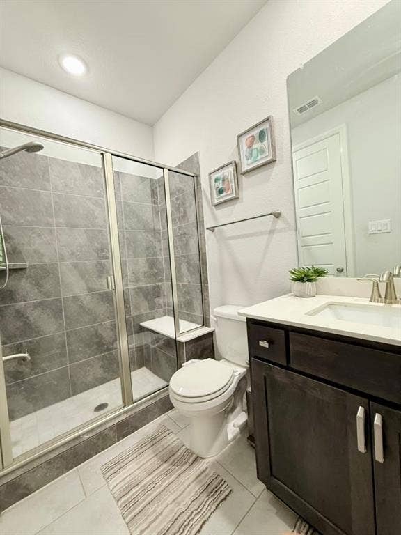 Walk-in shower with tile surround and built-in bench