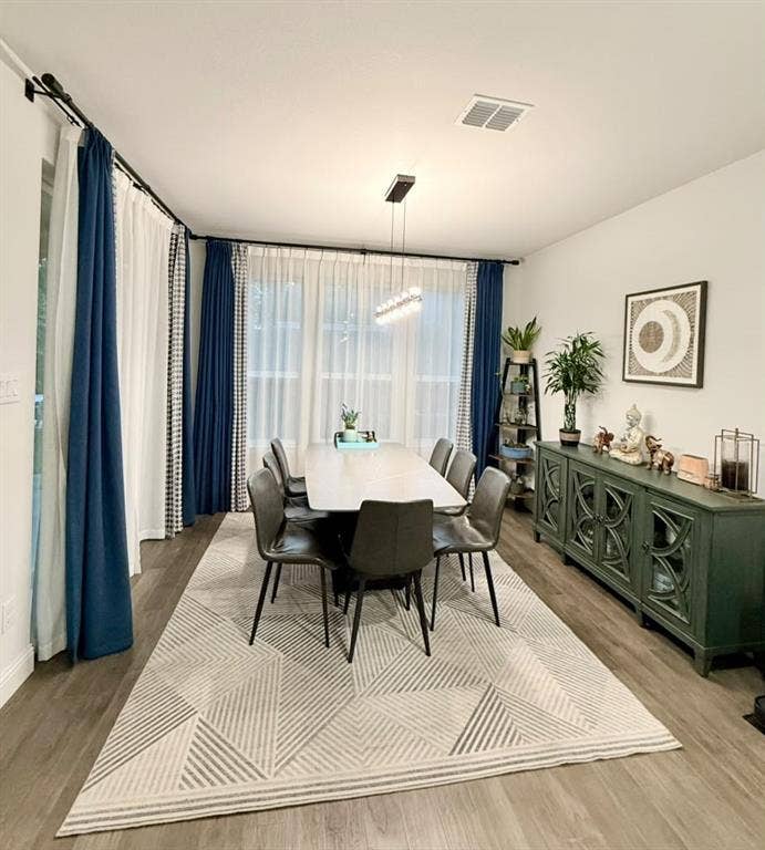 Recessed lighting and a linear ceiling fixture illuminate the space