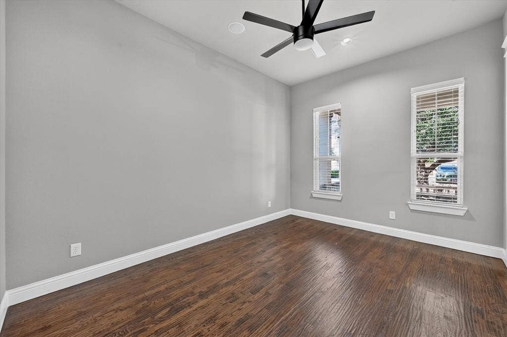 Wood-finish flooring, recessed lighting, and a contemporary ceiling fan
