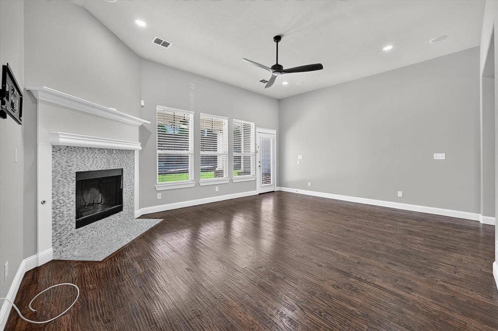 Wood-finish flooring, recessed lighting, and a ceiling fan