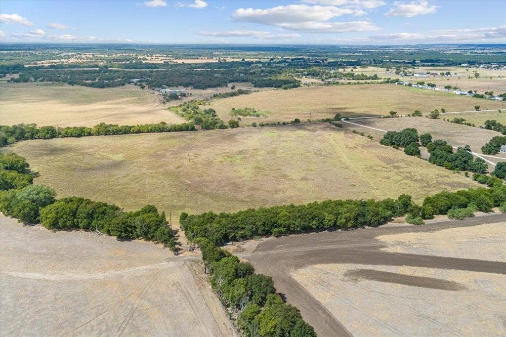 Expansive open fields with natural tree lines