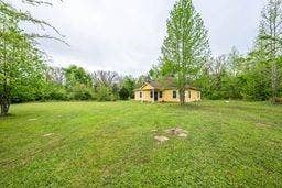 12770 E US 175 E, Larue, TX 75770 Single-story exterior with a covered entryway, sprawling acreage, and mature trees