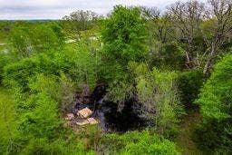 12770 E US 175 E, Larue, TX 75770 Wooded lot featuring mature deciduous trees and a natural rock formation