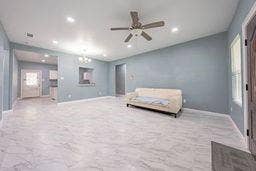 12770 E US 175 E, Larue, TX 75770 Open living area featuring stone-finish tile flooring, recessed lighting, ceiling fan, and pass-through window