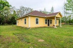 12770 E US 175 E, Larue, TX 75770 Single-story residence featuring horizontal lap siding, a hip roof with asphalt shingles, a covered front porch with support columns, and rectangular windows