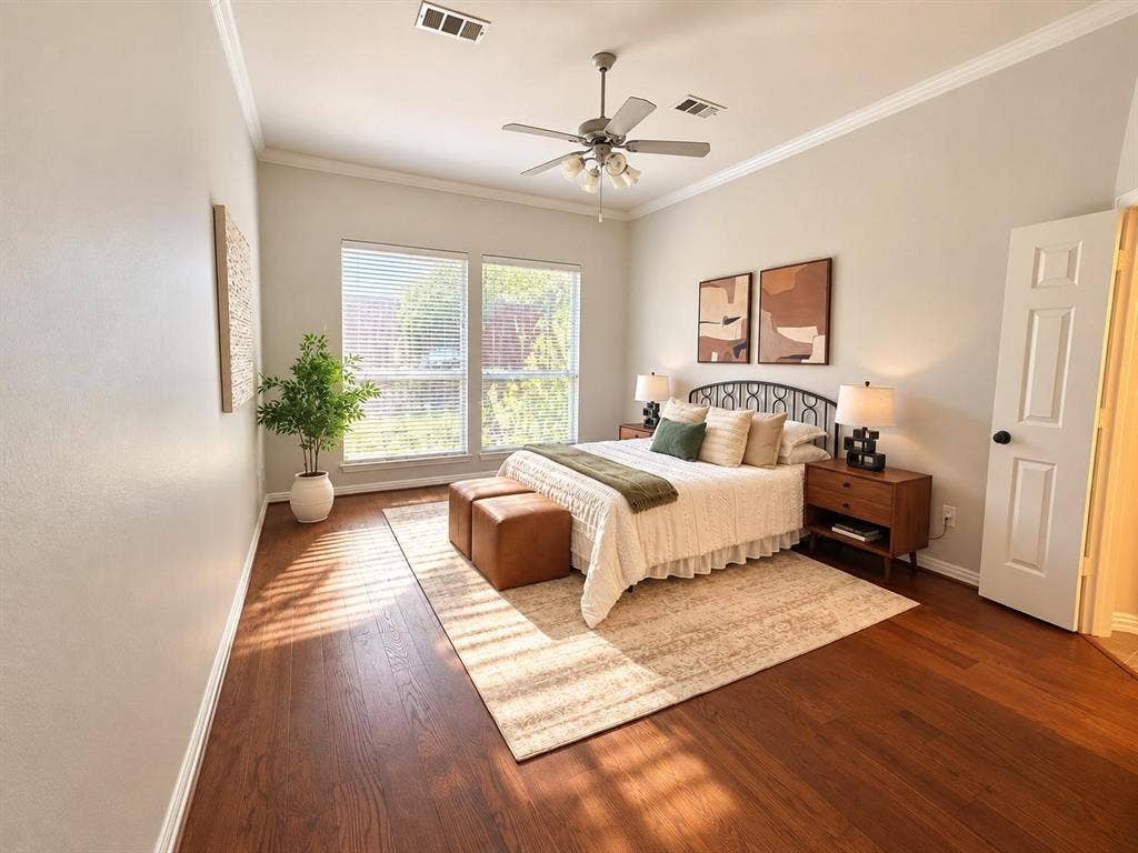 2917 Waterford Drive, Irving, TX 75063 Wood-finish flooring, crown molding, and a ceiling fan with integrated lighting