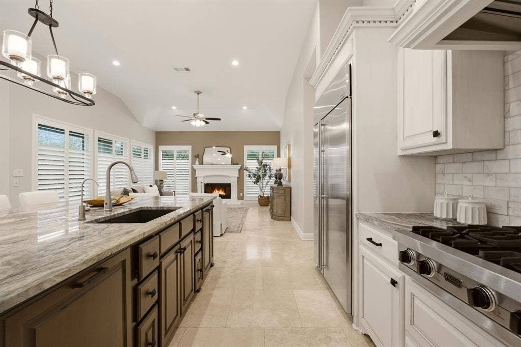 1120 Twin Oaks Drive, Prosper, TX 75078 The kitchen remodel includes the addition of a trash drawer, vertical tray cupboard, the deep farm sink, reverse osmosis system installed + cabinet hardware.