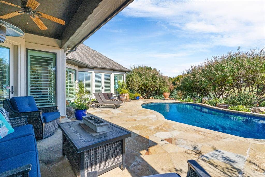 1120 Twin Oaks Drive, Prosper, TX 75078 The sellers' pride of ownership is evident in the meticulously maintained landscaping that surrounds the swimming pool. From vibrant, well-established plantings to the mature trees, this attention to detail is a genuine investment in preserving the outdoor space as a true highlight of the home.