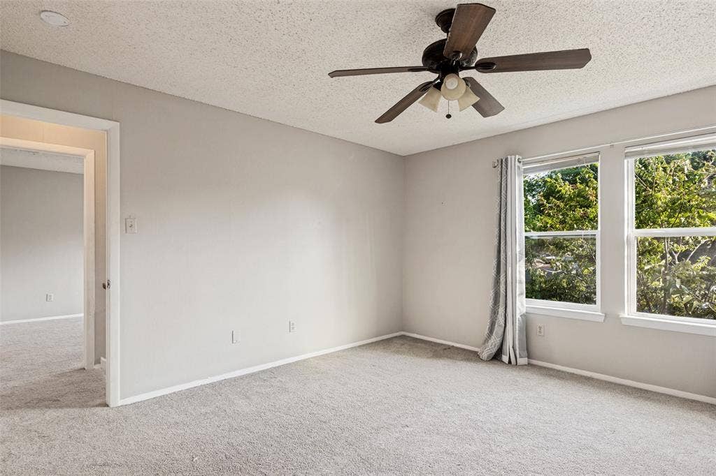 12206 Tyson Cove, #A, Austin, TX 78758 Soft gray wall paint, recessed lighting, ceiling fan with light fixture, carpeted flooring, and two windows