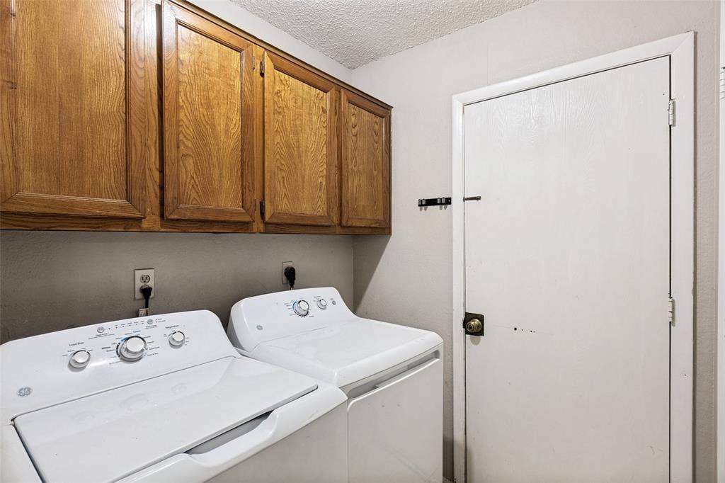 12206 Tyson Cove, #A, Austin, TX 78758 Wall-mounted wood cabinetry with paneled doors