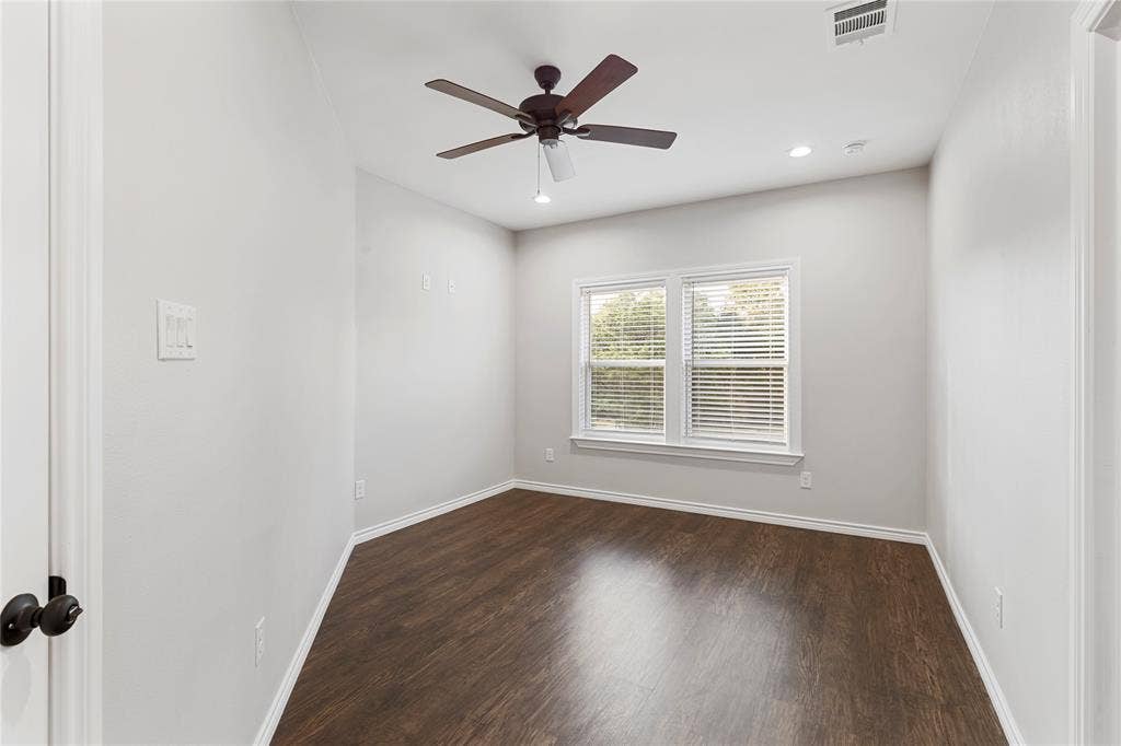 702 Linkcrest Drive, Duncanville, TX 75137 Wood-finish flooring with white trim, ceiling fan, recessed lighting, and a double window with blinds