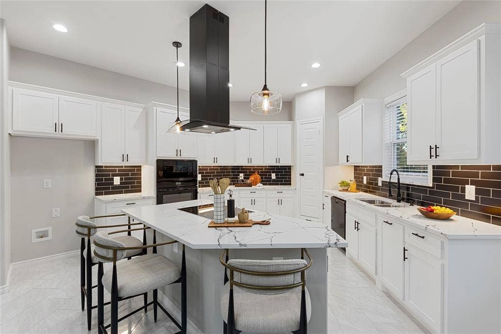 702 Linkcrest Drive, Duncanville, TX 75137 Kitchen featuring white shaker-style cabinetry, a large center island with a stone countertop, a built-in cooktop, and a matching black range hood