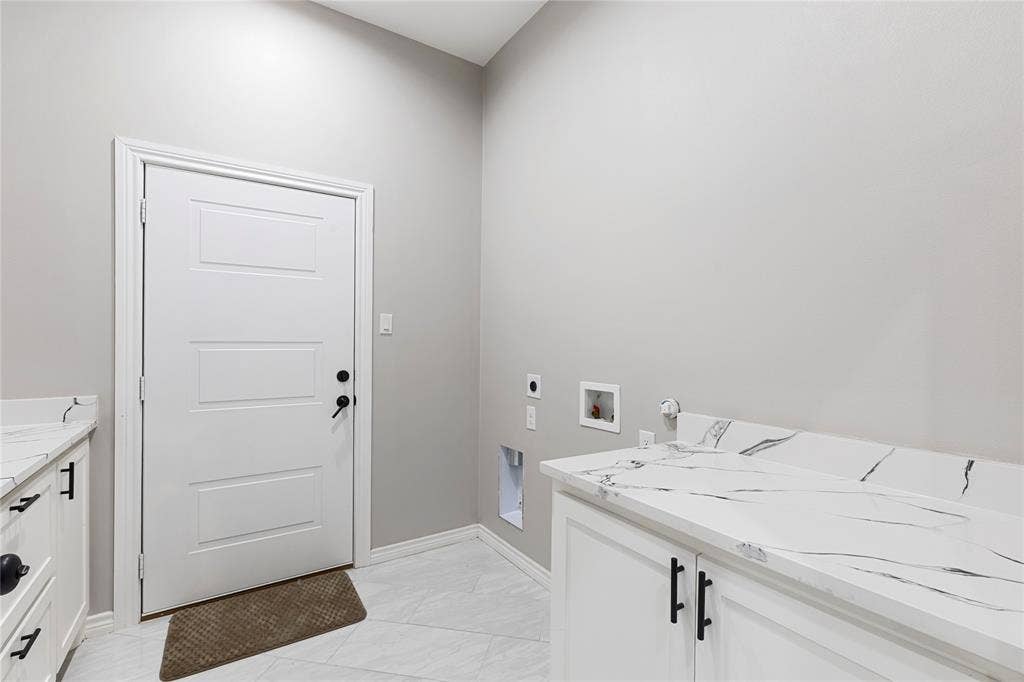 702 Linkcrest Drive, Duncanville, TX 75137 White paneled door with black hardware