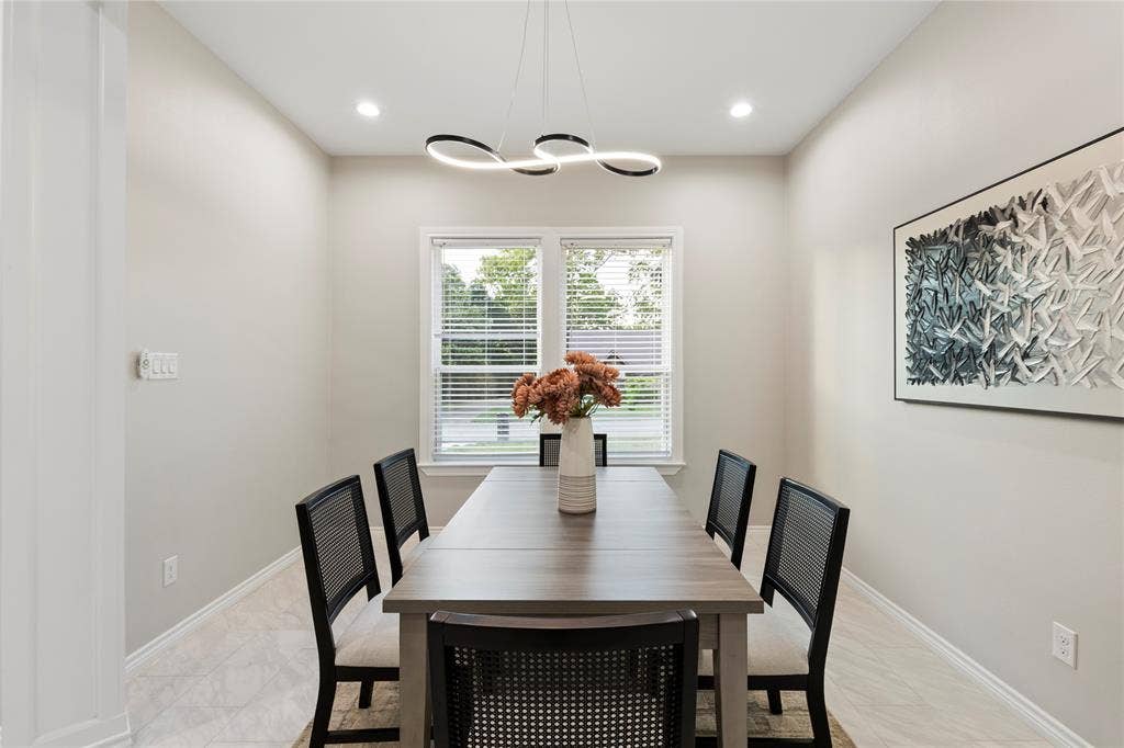702 Linkcrest Drive, Duncanville, TX 75137 Recessed lighting, contemporary linear chandelier, window with blinds, light-toned walls, and wood-finish flooring