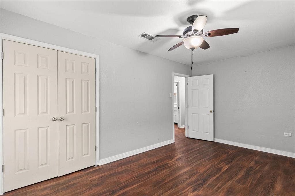 4205 Fort Avenue, Waco, TX 76710 Wood-finish flooring with a ceiling fan and light fixture