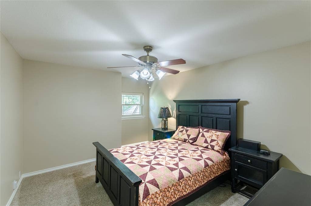 4009 Wilshire Court, Plano, TX 75023 Neutral-toned walls, carpeted flooring, and a window with natural light