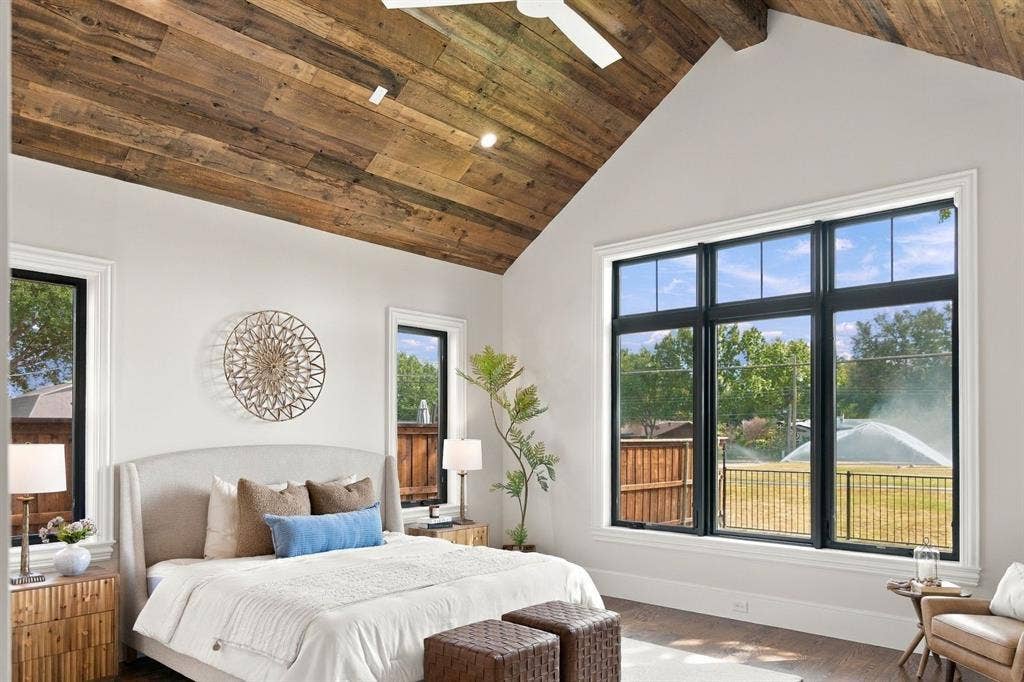 3368 Dorado Beach Drive, Farmers Branch, TX 75234 Vaulted wood-plank ceiling with exposed beams, large multi-pane windows, and wood-finish flooring