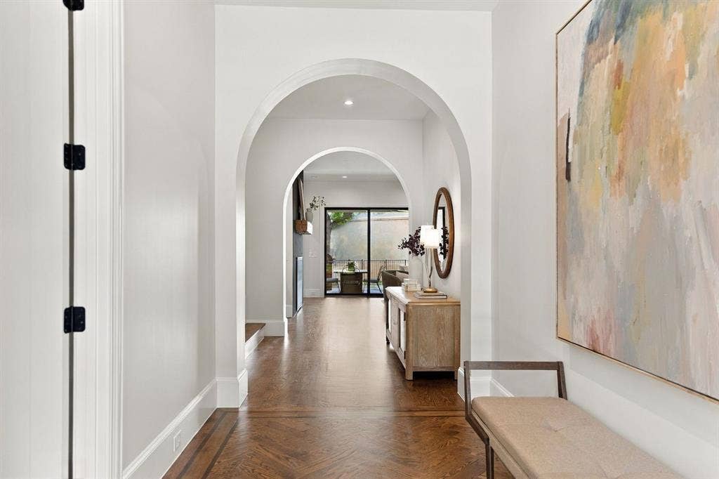 3368 Dorado Beach Drive, Farmers Branch, TX 75234 Arched doorways, recessed lighting, and wood-finish flooring with a patterned inlay