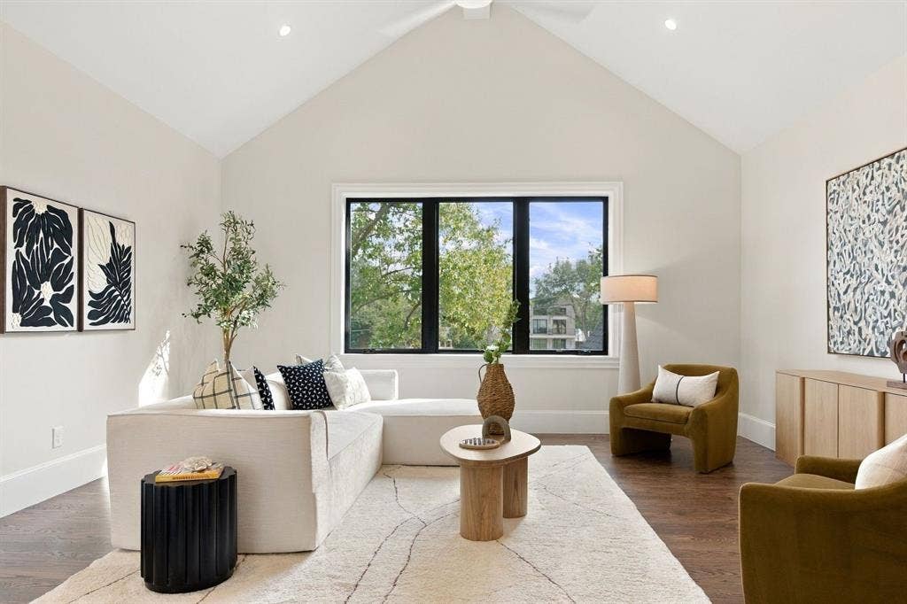 3368 Dorado Beach Drive, Farmers Branch, TX 75234 Vaulted ceiling, recessed lighting, wood-finish flooring, large multi-pane window with dark trim, and a ceiling fan