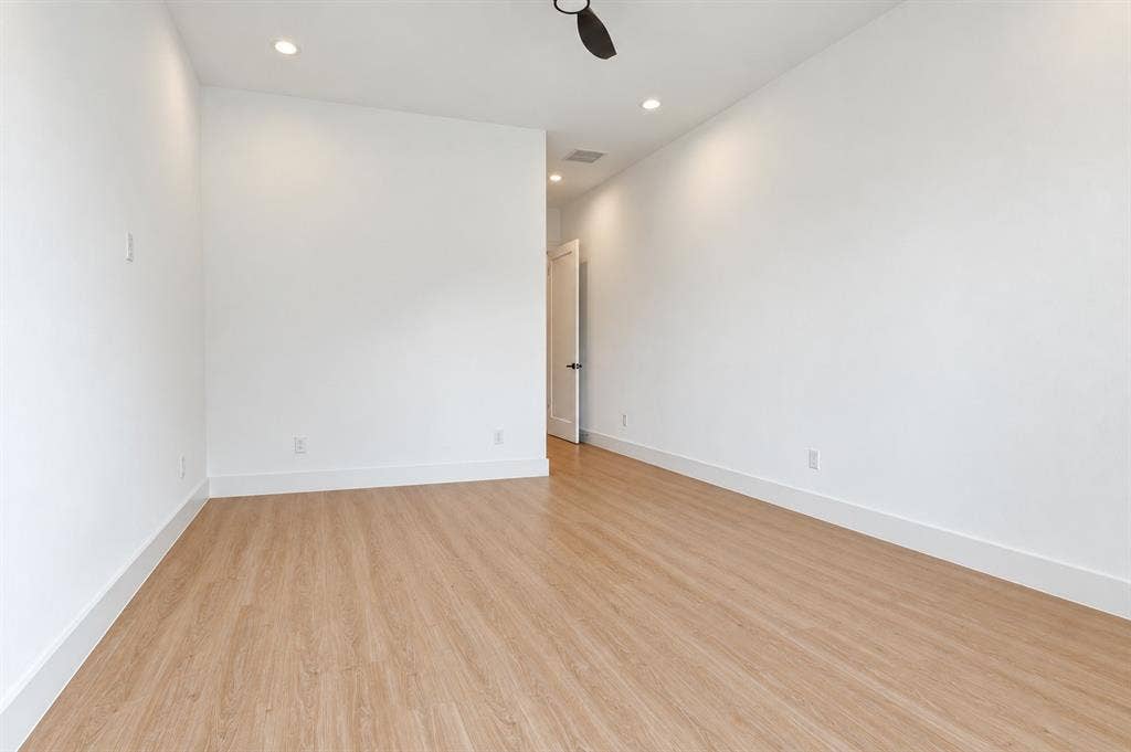 316 Avenue L, Dallas, TX 75203 Wood-finish flooring, recessed lighting, and a ceiling fan