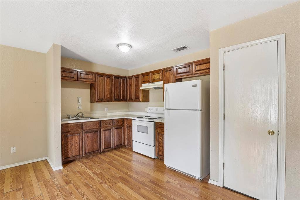 3100 Hale Avenue, #101 & 102, Fort Worth, TX 76106 Open kitchen with refrigerator that conveys
