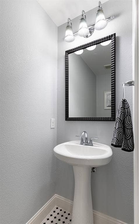 Half bath off game room.
