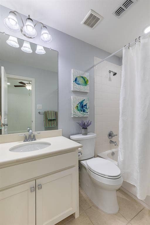 En-suite bath with tub shower combo.