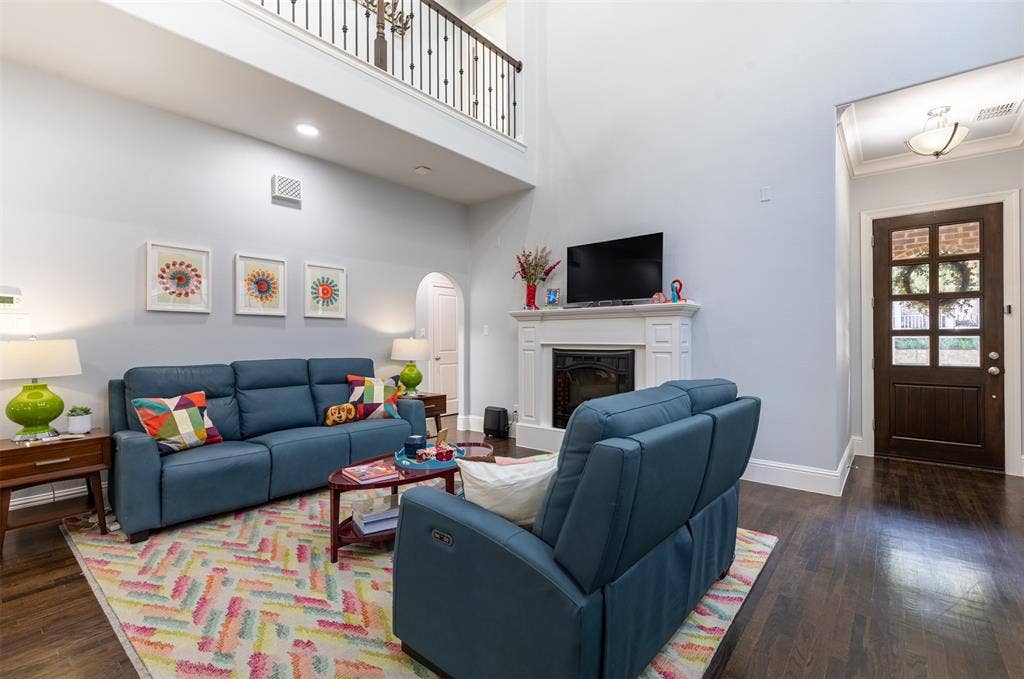 Living room anchored by a cozy fireplace.