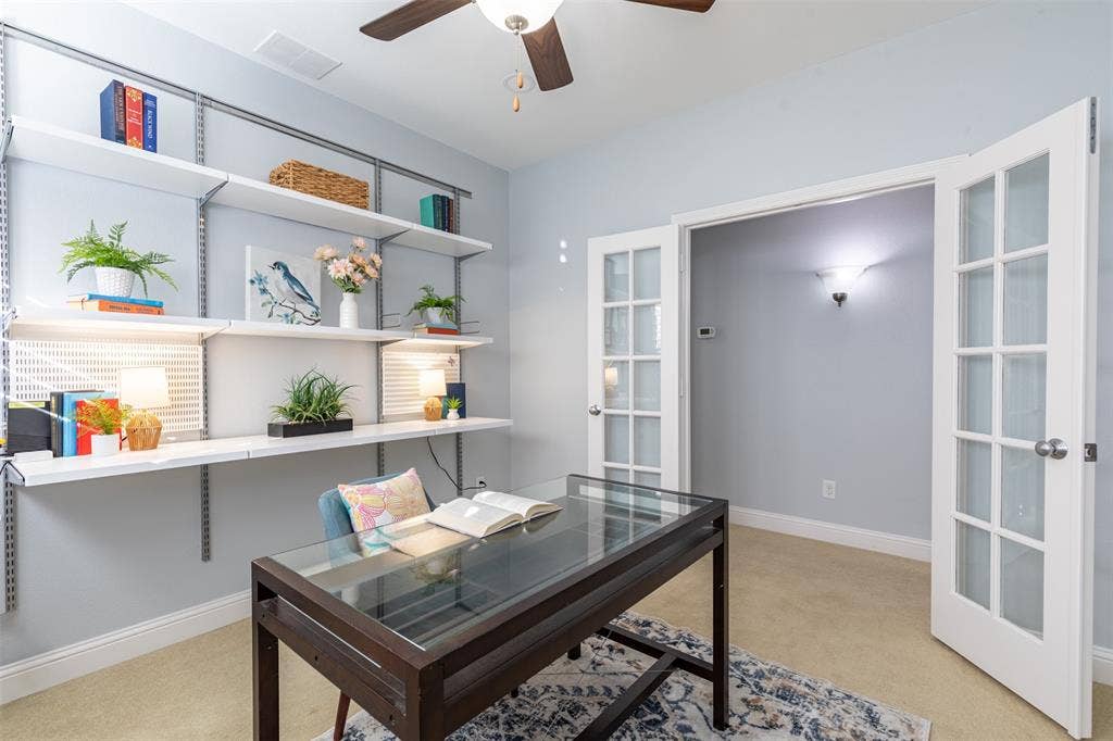 Office with glass French door entry.