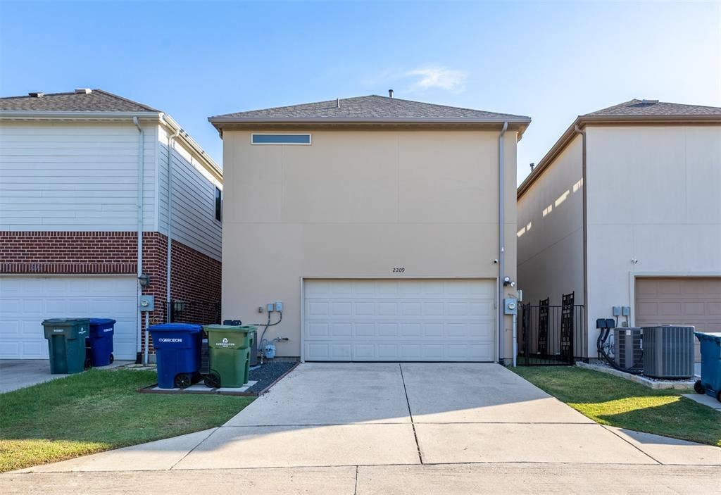 Back of home with garage.