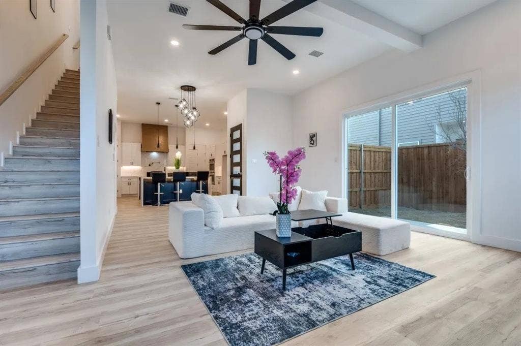 2802 Guymon Street, Dallas, TX 75212 Open-concept living space featuring wood-finish flooring, recessed lighting, and a modern ceiling fan