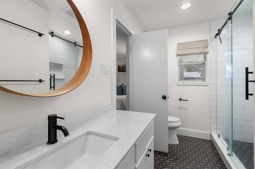 Beautiful primary bath with extra large vanity and stunning walk-in shower.