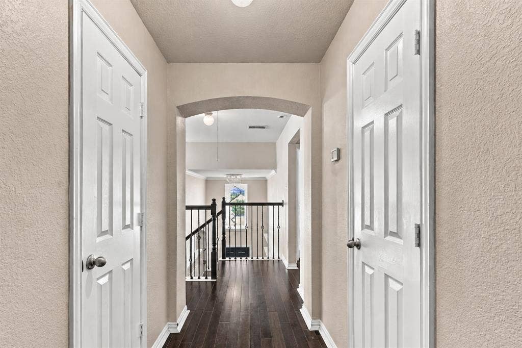 1905 Canyon Wren Drive, McKinney, TX 75071 Upstairs hallway featuring wood-style floor and recessed lighting.