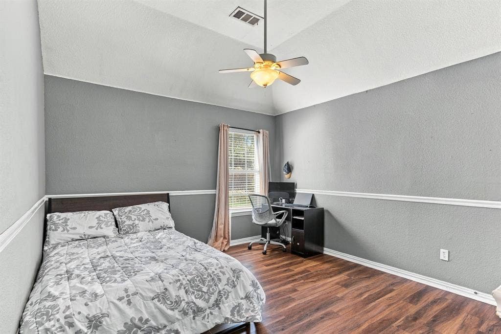 1905 Canyon Wren Drive, McKinney, TX 75071 Vaulted ceiling with a ceiling fan, wood-style flooring, and window with blinds