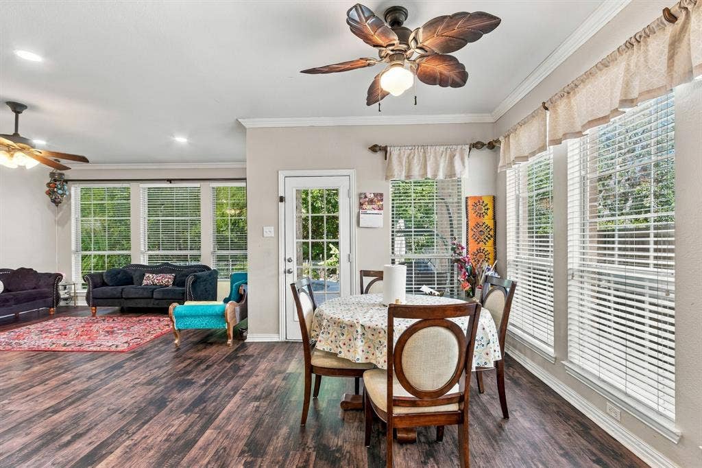 1905 Canyon Wren Drive, McKinney, TX 75071 Wood-style flooring, recessed lighting, crown molding, multiple windows with blinds, and ceiling fans
